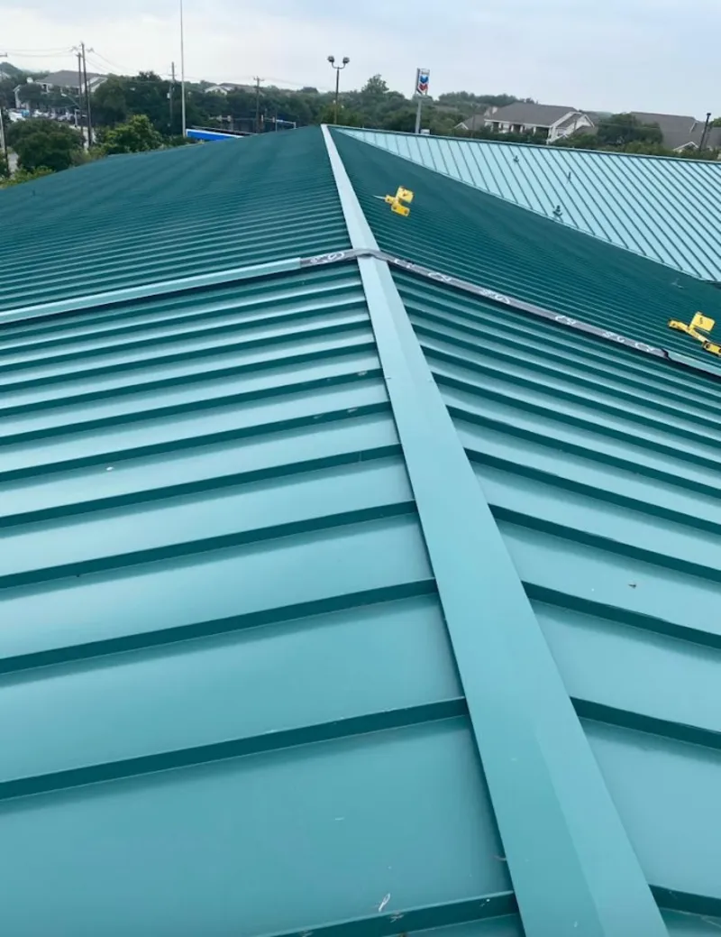 Green commercial metal roof ridge and valley for Metal Roof Repair in La Riviera