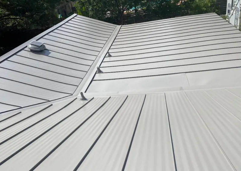 Solar attic fan installed on a metal roof for Roof Ventilation in La Riviera
